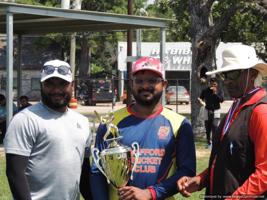 Cougars team management with Championship Trophy